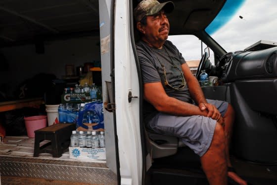 Jesus Vasquez sits in his van waiting to return to his home near Lahaina, on Aug. 10, 2023. He and other evacuees camped in a parking lot along the Honoapiilani Highway, hoping to be allowed back into Lahaina, two days after a devastating wildfire tore through the community.<span class="copyright">Robert Gauthier—Los Angeles Times/Getty Images</span>