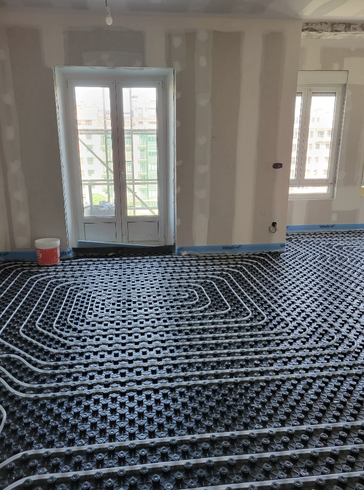 A view of flooring installation featuring a heating grid system