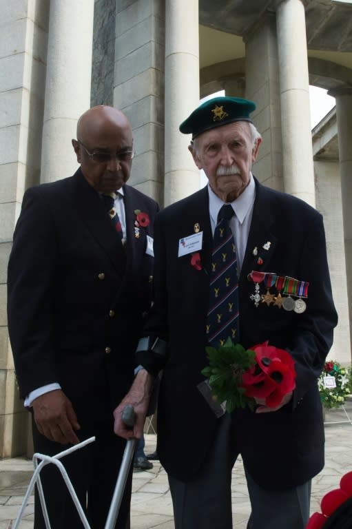 War veterans take part in a ceremony marking the 100th anniversary of the end of the World War I at Taukkyan War Cemetery, in Yangon