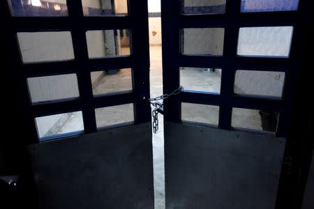 A locked depatment gate is seen at Tripoli Central Hospital in Tripoli, Libya, July 18, 2016. Picture taken July 18, 2016. REUTERS/Ismail Zitouny