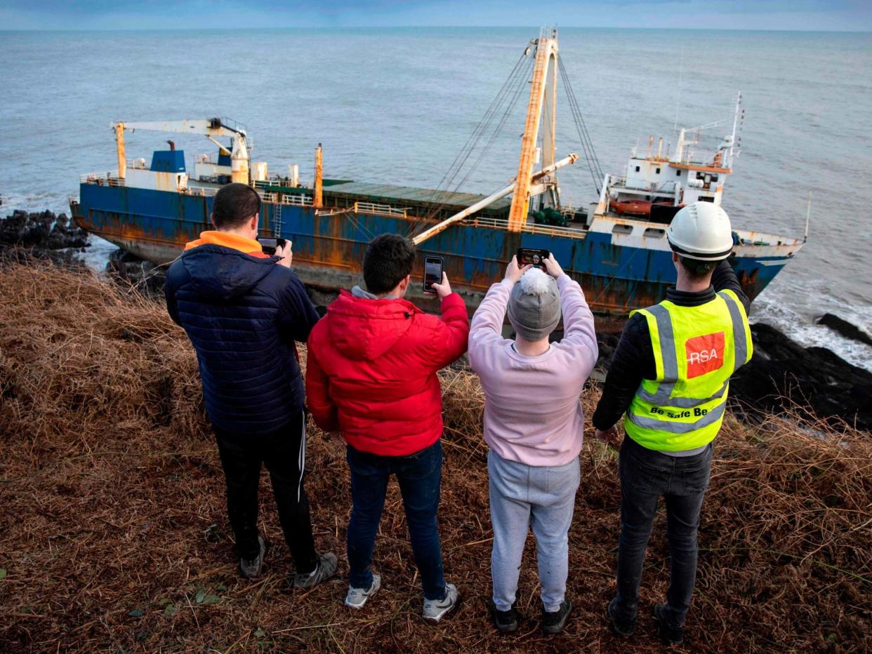 Visitors look over the MV Alta after it washed up near the village of Ballycotton in southern Ireland: AFP via Getty Images