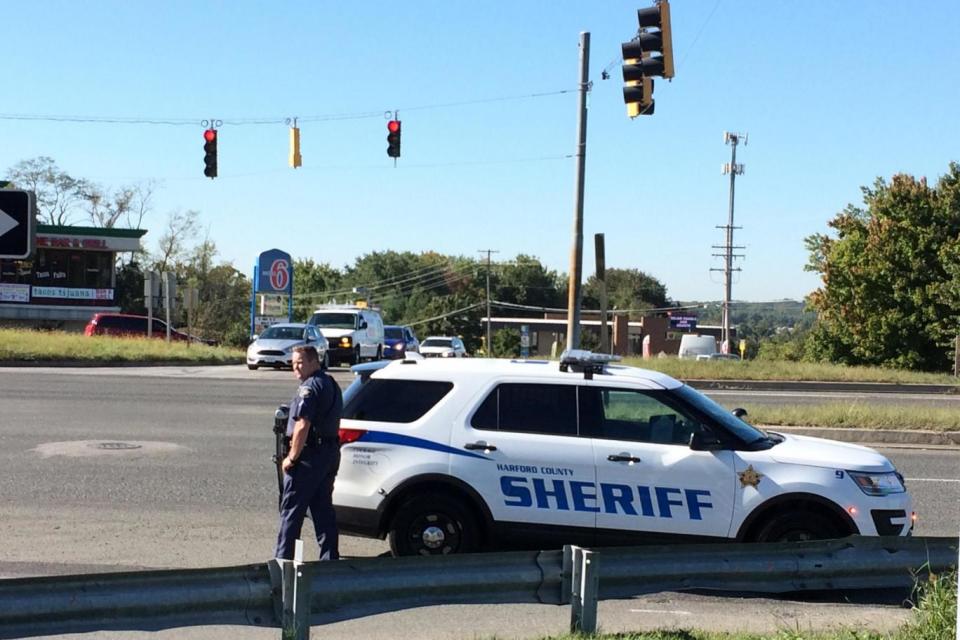 Fatal shooting: Police at the scene at a business park in the Edgewood area of Harford County Wednesday (Rex Features)