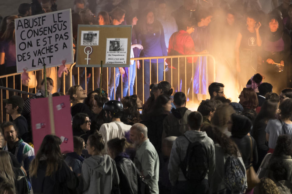 People protest during a nationwide women's strike on Friday, June 14, 2019, in Lausanne, Switzerland. There is list of several reasons motivating people to take part in the strike. These range from unequal wages to pressures on part-time employees, the burden of household work and sexual violence. (Laurent Gillieron/Keystone via AP)