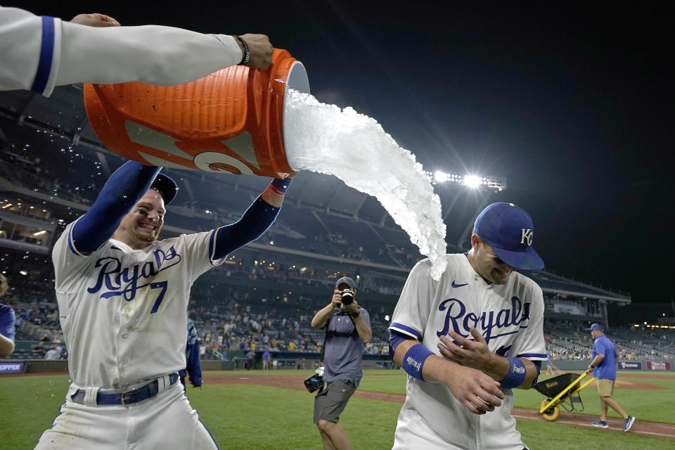 Kansas City Royals' Bobby Witt Jr. (7) douses Michael Massey after their baseball game against the New York Mets Wednesday, Aug. 2, 2023, in Kansas City, Mo. The Royals won 4-0. (AP Photo/Charlie Riedel)