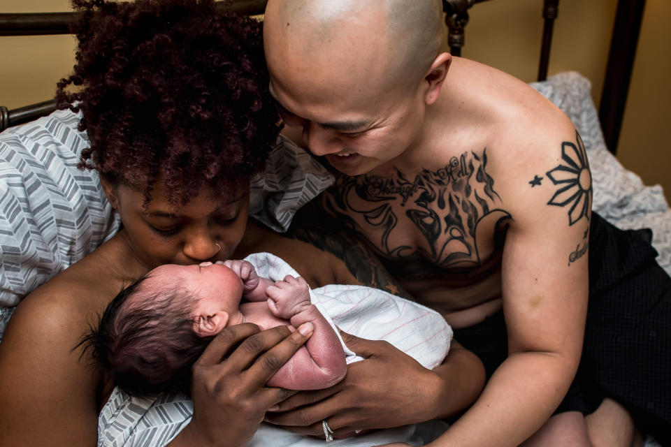 "This new dad couldn't stop smiling at his beautiful new daughter. Immediately after birth, the three of them snuggled up together for hours."