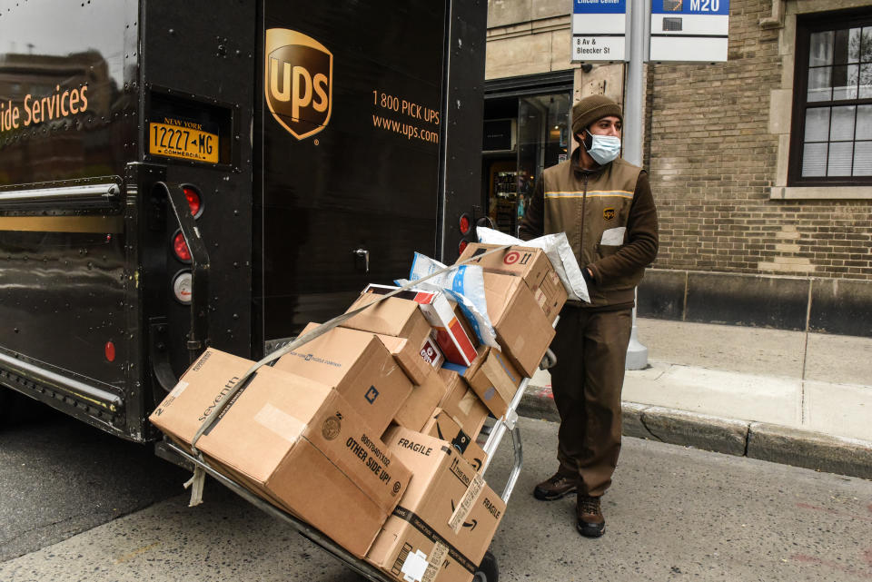 A United Parcel Service worker delivers packages on April 29, 2020 in New York City.