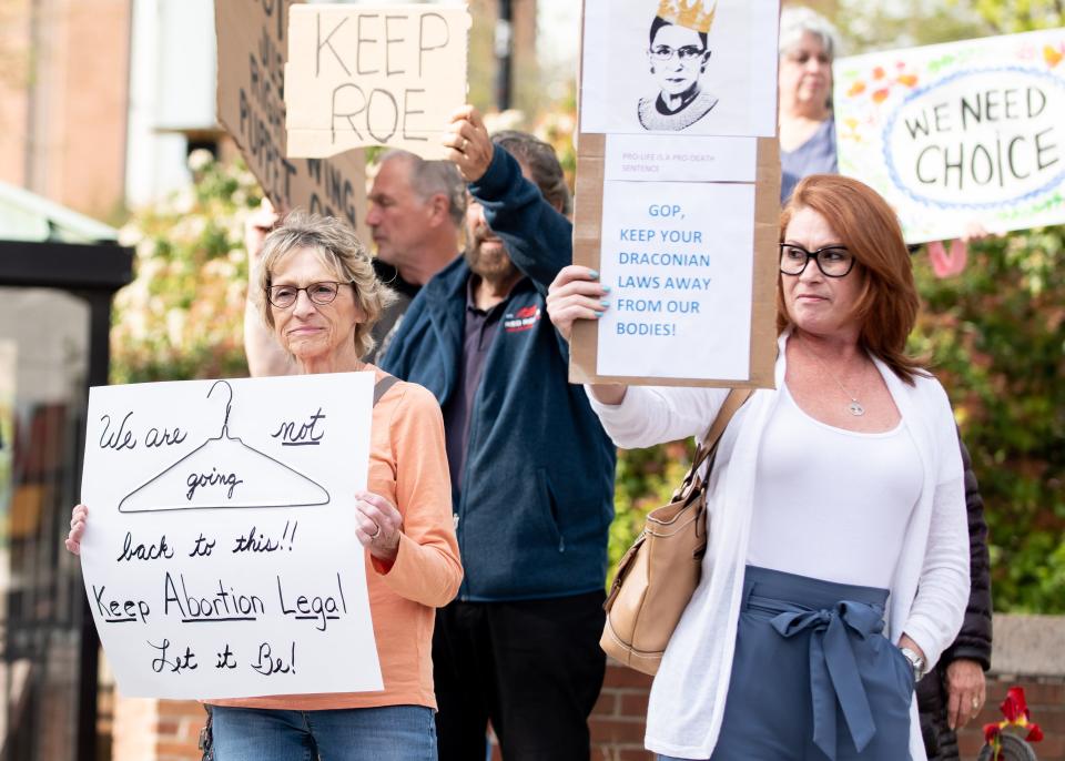 Connie Moyer, left, of Sellersville, and Jenny Klock, of Horsham, hold up signs during a rally held in downtown Doylestown Borough calling for the protection of abortion rights, on Tuesday, May 3, 2022. A second rally was held on Sunday, May 15.