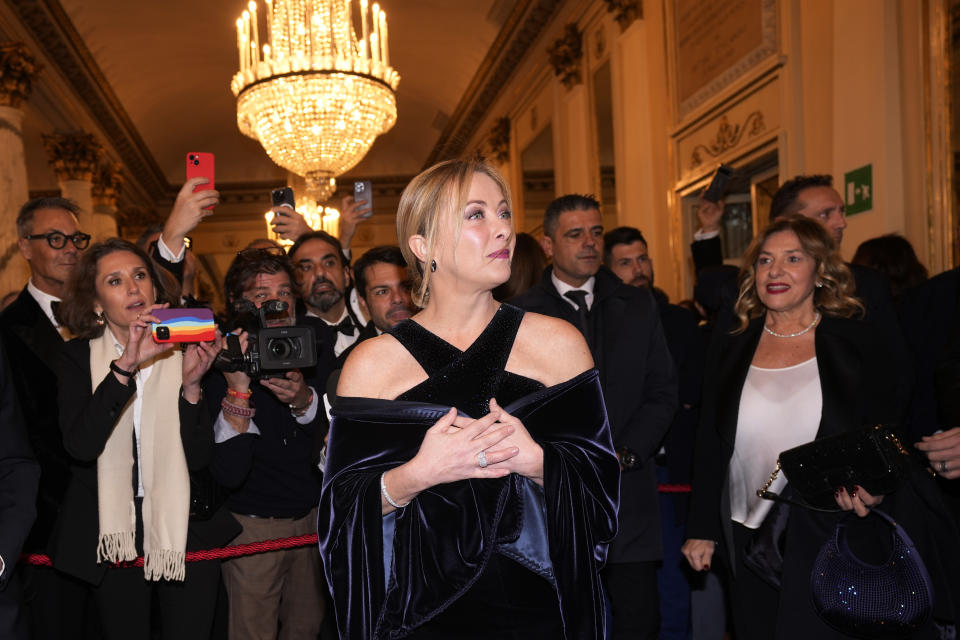 Italian Premier Giorgia Meloni arrives for the premiere of Modest Mussorgsky's Boris Godunov in Milan, Italy, Wednesday, Dec. 7, 2022. Italy’s most famous opera house, Teatro alla Scala, opened its new season Wednesday with the Russian opera “Boris Godunov,” against the backdrop of Ukrainian protests that the cultural event is a propaganda win for the Kremlin during Russia’s invasion of Ukraine. (AP Photo/Antonio Calanni)