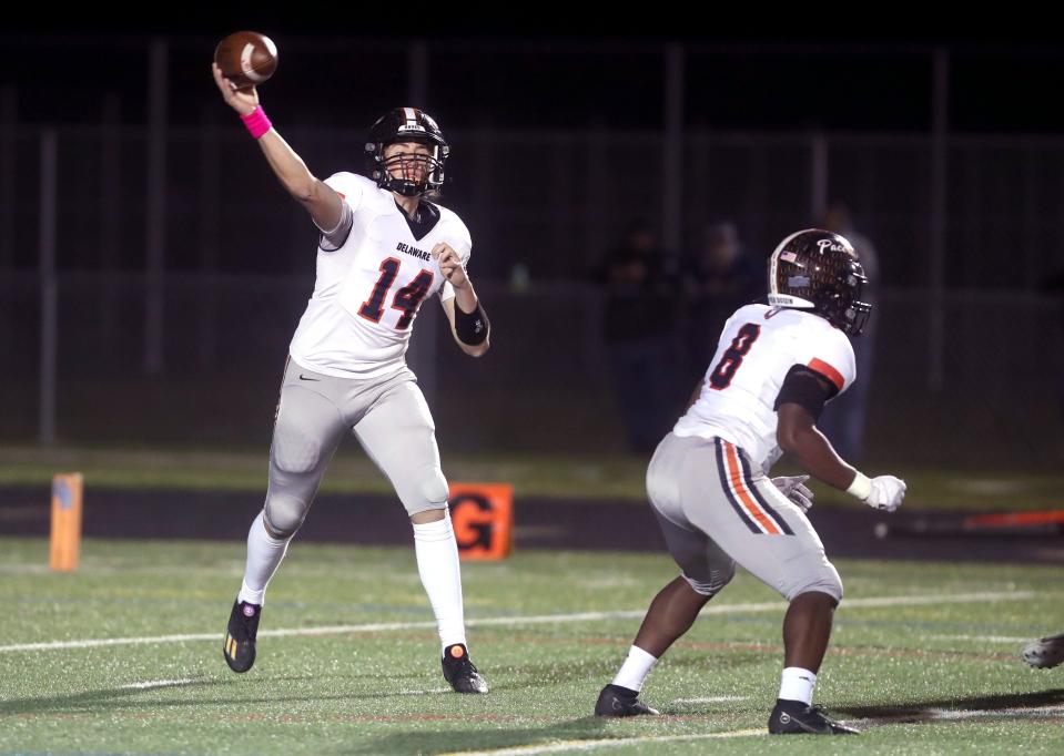 Delaware Hayes' Jake Lowman passes downfield during an OHSAA Division I First Round playoff game against Olentangy Berlin on Oct. 28 at Olentangy Berlin High School in Delaware.