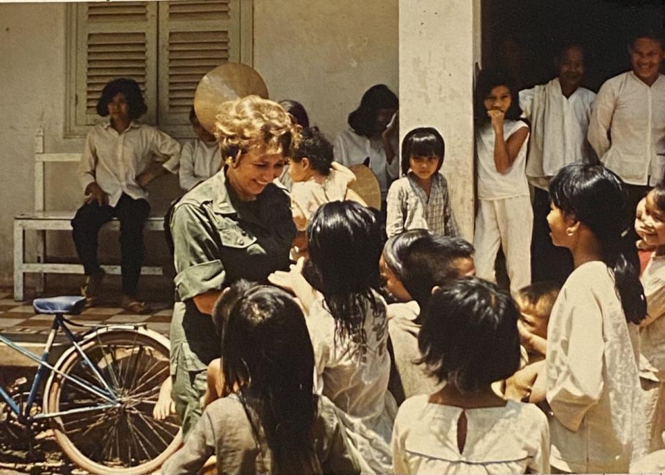 Anna Kathryn Tolbert interacts with Vietnamese children during her time working as a nurse during the Vietnam War.