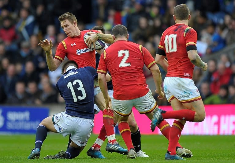 Scotland centre Huw Jones (L) tackles Wales' wing Liam Williams during their Six Nations match at Murrayfield, in Edinburgh, on Febuary 25, 2017