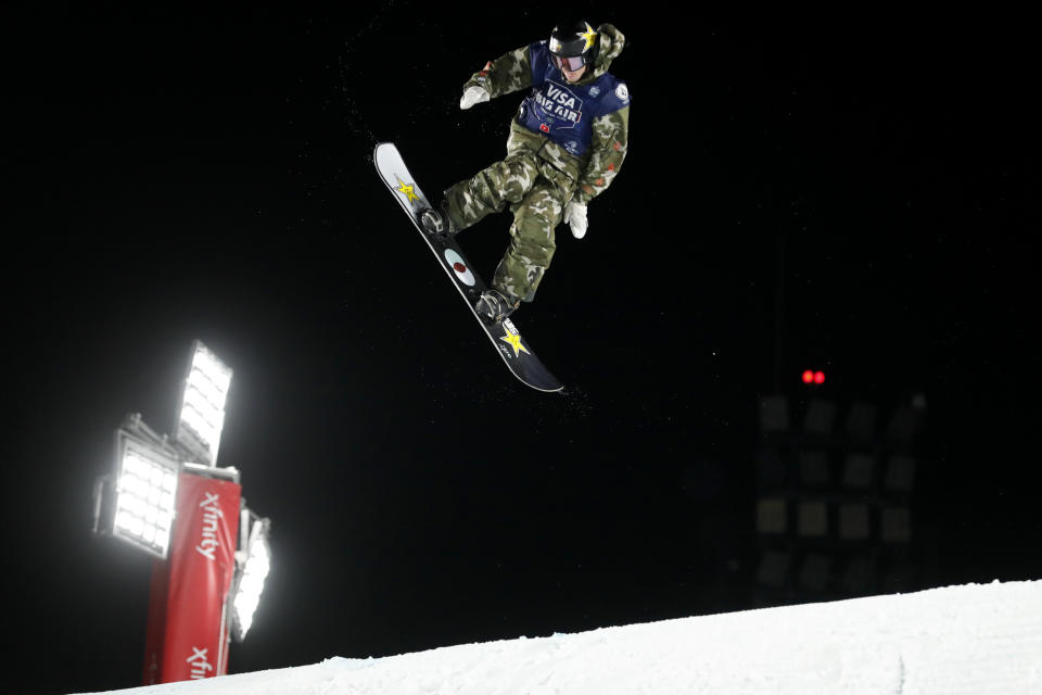 Lyon Farrell jumps during the finals of the Big Atlanta snowboard competition Friday, Dec. 20, 2019, in Atlanta. (AP Photo/John Bazemore)
