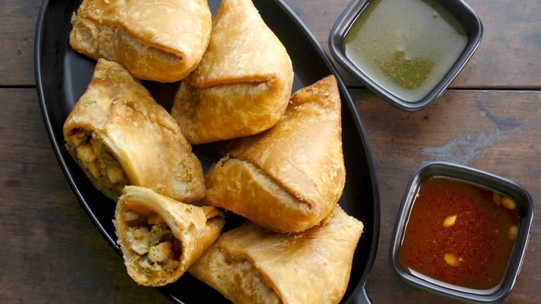 Plate of Punjabi samosas with dips