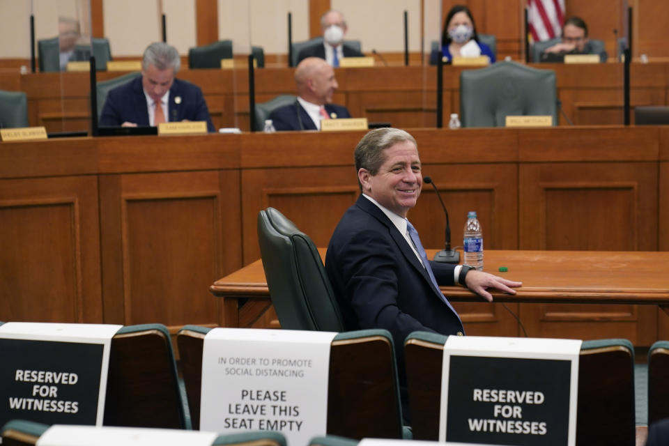 Kirk Morgan, Vistra chief executive officer, prepares to answerer questions for the Committees on State Affairs and Energy Resources as they hold a joint public hearing to consider the factors that led to statewide electrical blackouts, Thursday, Feb. 25, 2021, in Austin, Texas. The hearings were the first in Texas since a blackout that was one of the worst in U.S. history, leaving more than 4 million customers without power and heat in subfreezing temperatures. (AP Photo/Eric Gay)