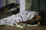 <p>Central American migrants making their way to the U.S. in a large caravan sleep in Tapachula, Mexico, Oct. 22, 2018. Despite Mexican efforts to stop them at the Guatemala-Mexico border, thousands of Central American migrants resumed their advance toward the U.S. border Sunday in southern Mexico. (Photo: Moises Castillo/AP) </p>