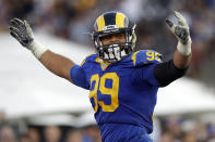FILE - In this Nov. 11, 2018, file photo, Los Angeles Rams defensive end Aaron Donald celebrates a fumble recovery and touchdown by defensive end Dante Fowler during the second half in an NFL football game against the Seattle Seahawks, in Los Angeles. Donald was selected to the 2010s NFL All-Decade Team announced Monday, April 6, 2020, by the NFL and the Pro Football Hall of Fame.(AP Photo/Alex Gallardo, File)