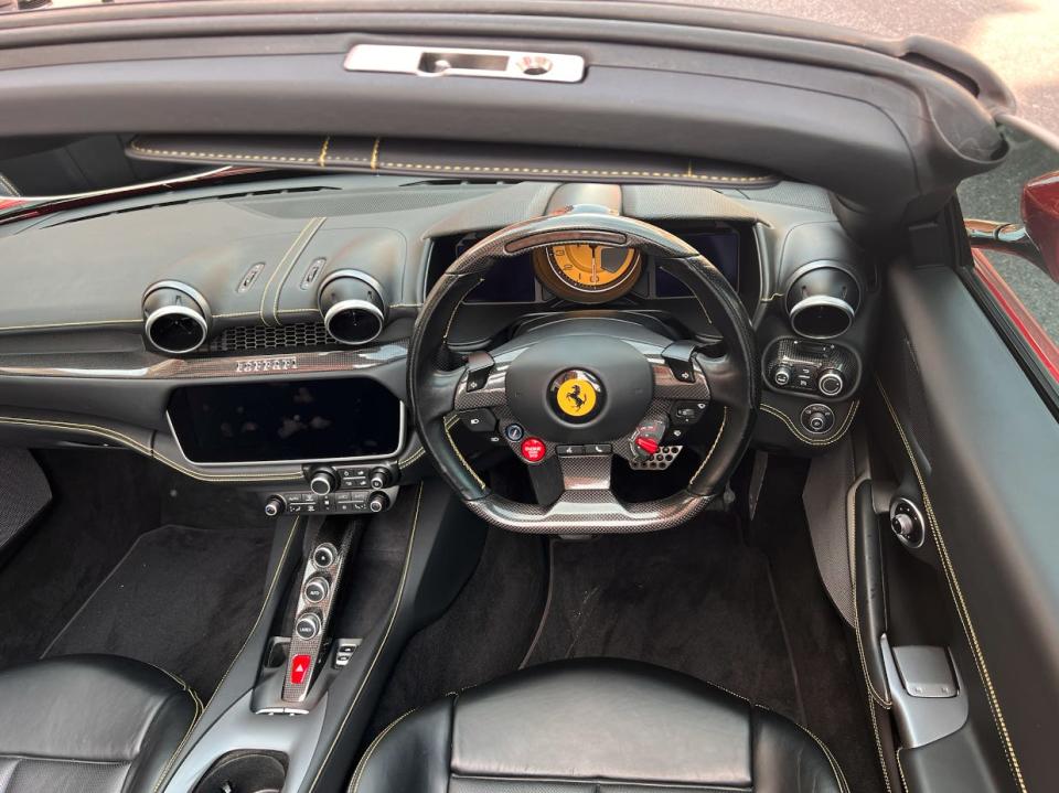 Steering wheel of the Ferrari Portofino, which features a number of controls.