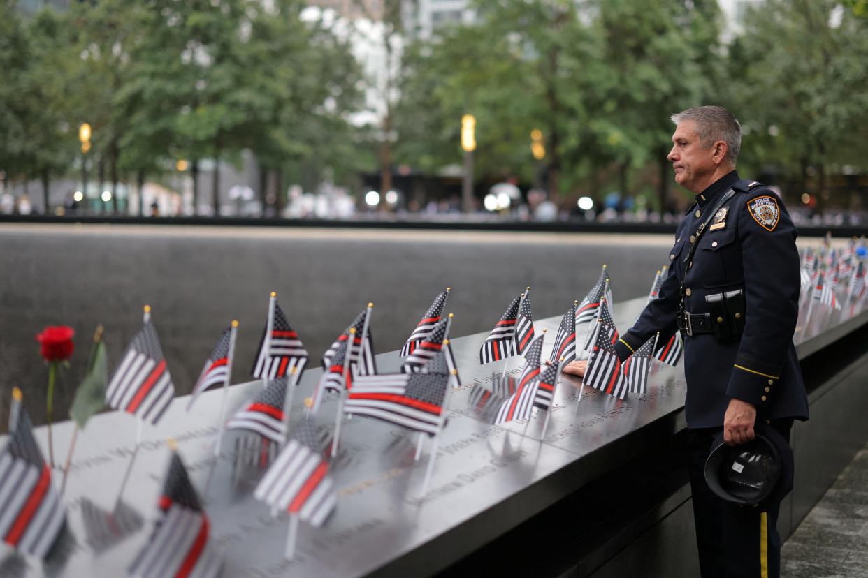 A New York City police officer at the Sept. 11 museum before the ceremony marking the 22nd anniversary of the World Trade Center attacks
