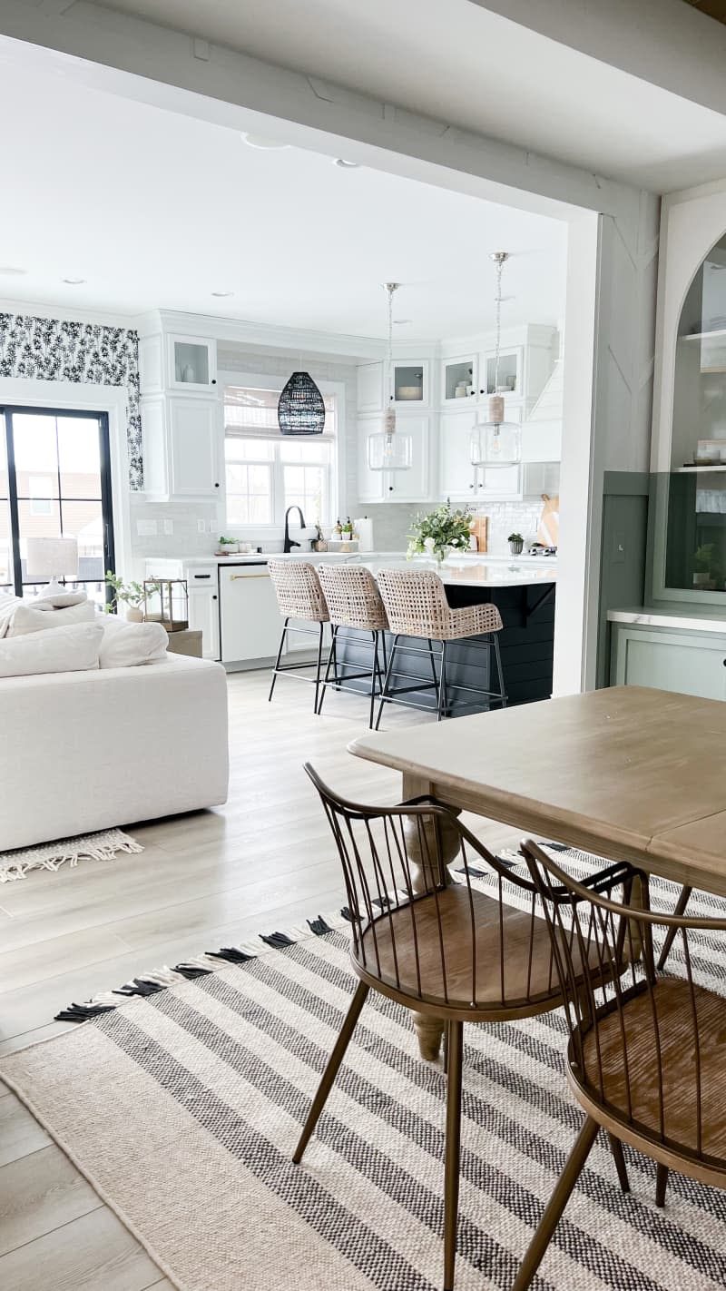 White kitchen with pendant lights and black hardware/fixtures