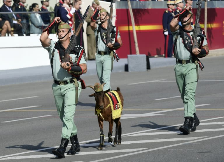 Legionnaires and their goat mascot march during the Spanish National Day military parade in Madrid on October 12, 2017