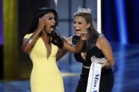 RNPS - PICTURES OF THE YEAR 2013 - Miss America contestant, Miss New York Nina Davuluri (L) reacts with 2013 Miss America Mallory Hagan after being chosen winner of the 2014 Miss America Pageant in Atlantic City, New Jersey, September 15, 2013. REUTERS/Lucas Jackson (UNITED STATES - Tags: ENTERTAINMENT SOCIETY TPX)