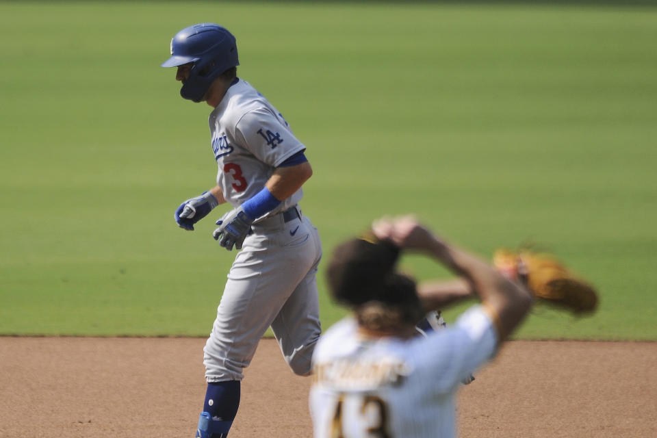 Los Angeles Dodgers' Chris Taylor rounds second base after hitting a solo home run off San Diego Padres relief pitcher Garrett Richards during the sixth inning of a baseball game Wednesday, Sept. 16, 2020, in San Diego. (AP Photo/Derrick Tuskan)