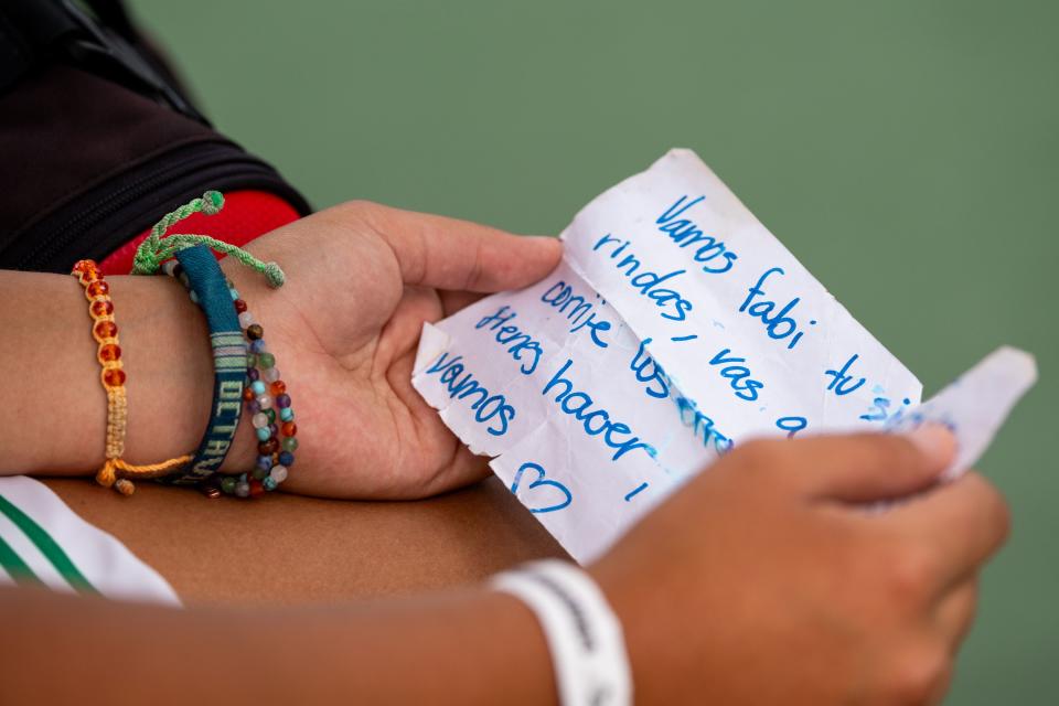 Hillcrest’s Fabiana Gonzalez reads a note from her family during the first singles finals against Orem’s Maya Inouye during the 2023 4A Girls Tennis Championships at Liberty Park Tennis Courts in Salt Lake City on Saturday, Sept. 30, 2023. Inouye won the match during a tie-break game in the third set. | Megan Nielsen, Deseret News