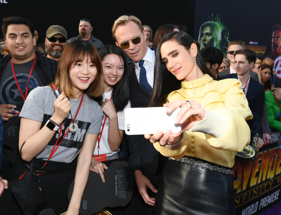 <p>The actor who plays Vision posed for fans while his actress wife was on camera duty. (Photo: Emma McIntyre/Getty Images) </p>