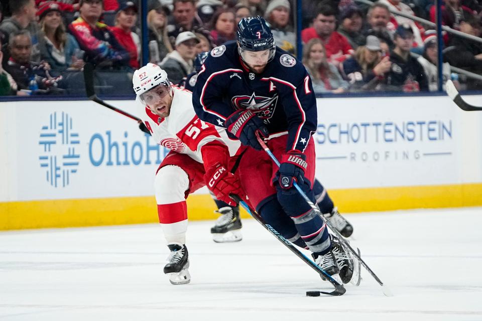 Oct 16, 2023; Columbus, Ohio, USA; Columbus Blue Jackets center Sean Kuraly (7) skates past Detroit Red Wings left wing David Perron (57) during the third period of the NHL hockey game at Nationwide Arena. The Blue Jackets lost 4-0.