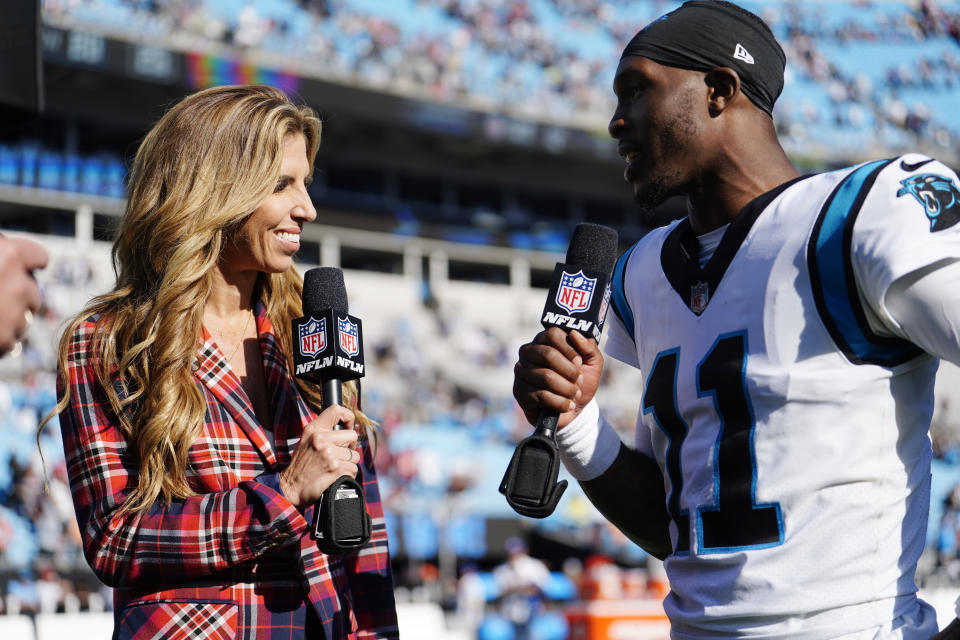 NFL side line reporter Sara Walsh, left, interviews Carolina Panthers quarterback PJ Walker (11) after an NFL football game Sunday, Oct. 23, 2022, in Charlotte, N.C. (AP Photo/Jacob Kupferman)