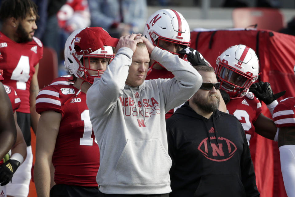 Nebraska head coach Scott Frost holds his head during the closing seconds of an NCAA college football game against Wisconsin in Lincoln, Neb., Saturday, Nov. 16, 2019. Wisconsin won 37-21. (AP Photo/Nati Harnik)