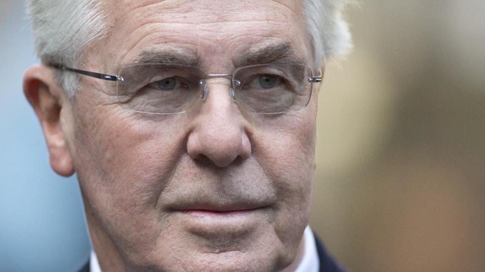 British public relations guru Max Clifford poses for the media as he arrives at Southwark Crown Court in London for jury selection before his trial on charges of indecent assault, Wednesday, March 5, 2014. Clifford faces 11 counts of indecent assault on 7 alleged teenagers between 1966 and 1984. (AP Photo/Alastair Grant)