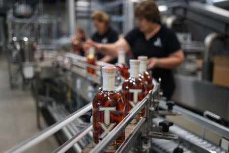 Employees package TX Whiskey at the Firestone & Robertson (F&R) Whiskey Ranch in Forth Worth, Texas, U.S., May 24, 2018. REUTERS/Adrees Latif