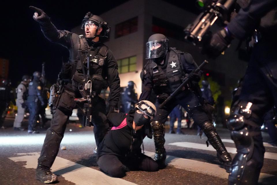 Arresting a protester on Aug. 11, 2020, in Portland, Oregon.