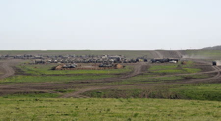 Vehicles are parked outside a camp at the Russian military training ground 'Kuzminsky' near the Russian-Ukrainian border in the Rostov region, Russia, May 23, 2015. Picture taken May 23, 2015. REUTERS/Stringer