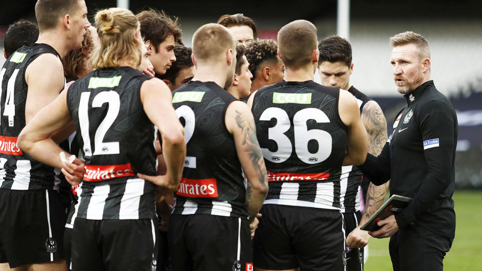 Nathan Buckley, pictured here addressing his players during Collingwood's clash with Geelong.