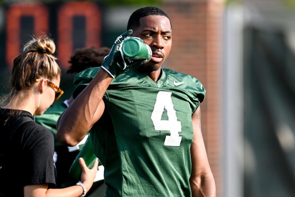 Michigan State's C.J. Hayes takes a drink during the opening day of fall camp on Thursday, Aug. 5, 2021, on the MSU campus in East Lansing.