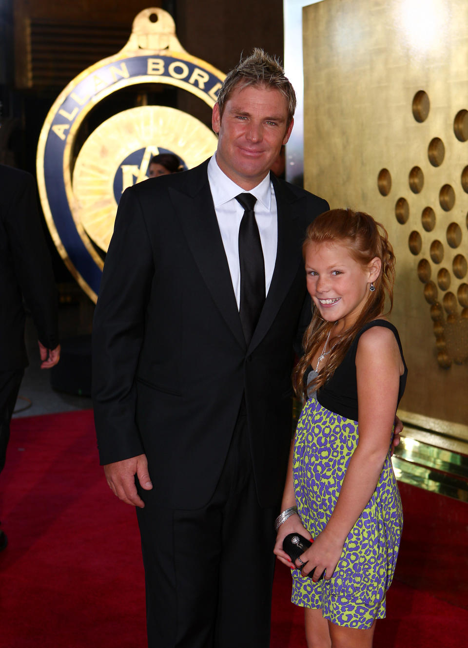 Shane Warne and daughter arrive on the red carpet at the Crown Casino in Melbourne for the 2008 Allan Border Medal  (Photo by Jon Buckle - PA Images via Getty Images)