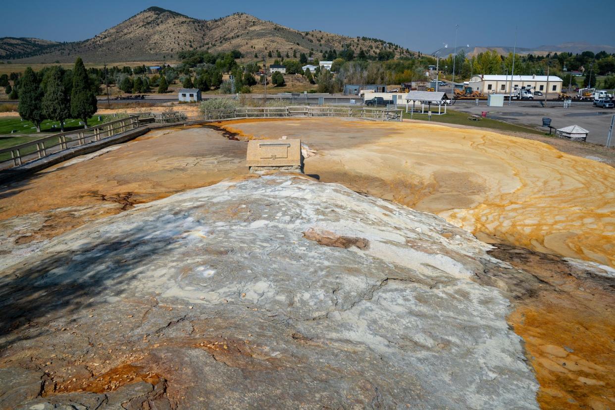 Captive geyser in Soda Springs Idaho. Mineral terraces of the hot springs