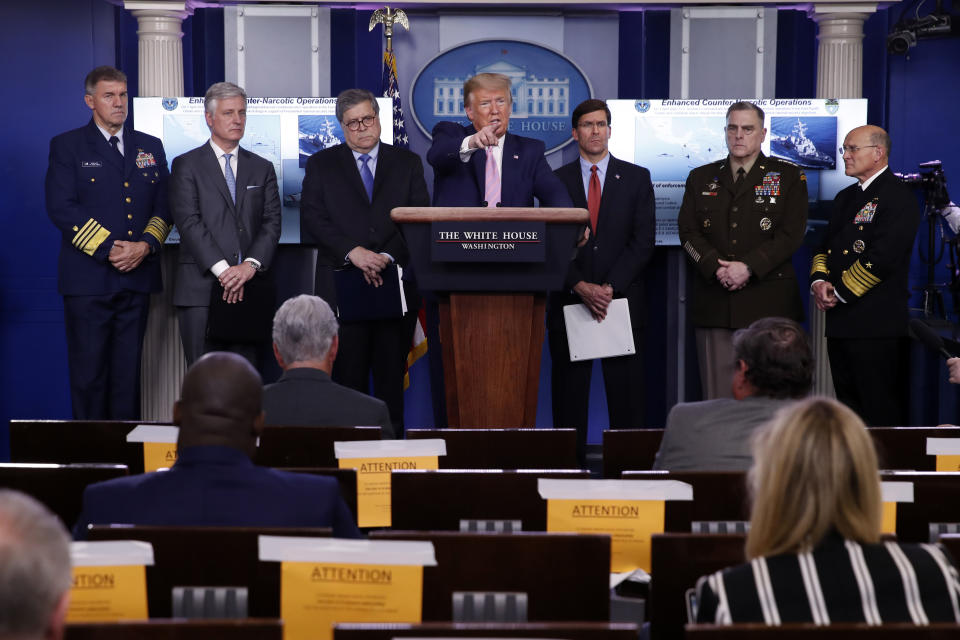 President Donald Trump speaks about the coronavirus in the James Brady Press Briefing Room of the White House, Wednesday, April 1, 2020, in Washington, as from left, Adm. Karl Leo Schultz, commandant of the Coast Guard, national security adviser Robert O'Brien, Attorney General William Barr, Defense Secretary Mark Esper, Chairman of the Joint Chiefs Gen. Mark Milley, and Navy Adm. Michael Gilday, Chief of Naval Operations, listen. (AP Photo/Alex Brandon)