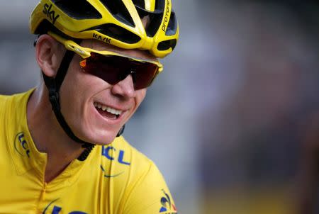 FILE PHOTO: Cycling - Tour de France cycling race - The 113-km (70,4 miles) Stage 21 from Chantilly to Paris, France, July 24, 2017. Yellow jersey leader Team Sky rider Chris Froome of Britain celebrates on the finish line. REUTERS/Jean-Paul Pelissier/File Photo