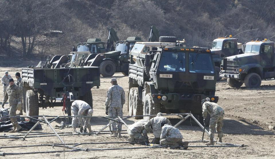 U.S. Army soldiers prepare their military exercise in Paju, near the border with North Korea, South Korea, Monday, March 6, 2017. North Korea on Monday fired four banned ballistic missiles that flew about 1,000 kilometers (620 miles), with three of them landing in Japan's exclusive economic zone, South Korean and Japanese officials said, in an apparent reaction to huge military drills by Washington and Seoul that Pyongyang insists are an invasion rehearsal. (AP Photo/Ahn Young-joon)