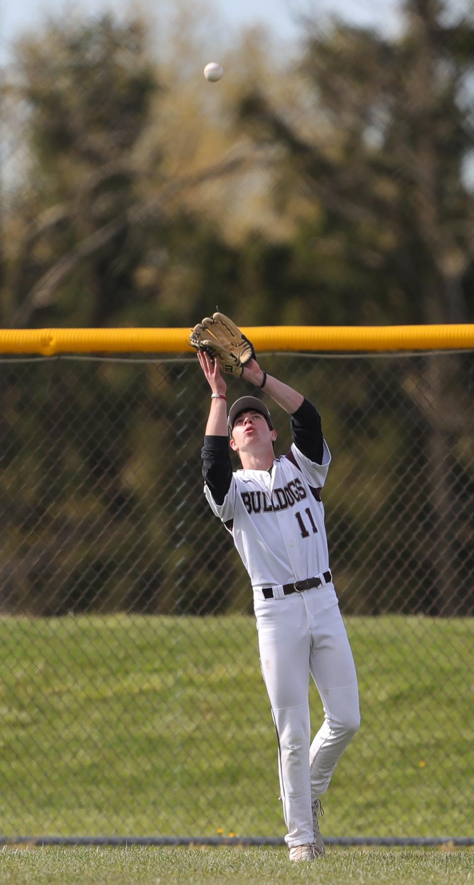Woodridge right fielder Nathan Martin gets under a fly ball hit by STVM's Jakeb Beard during the third inning on May 4 in Cuyahoga Falls.
