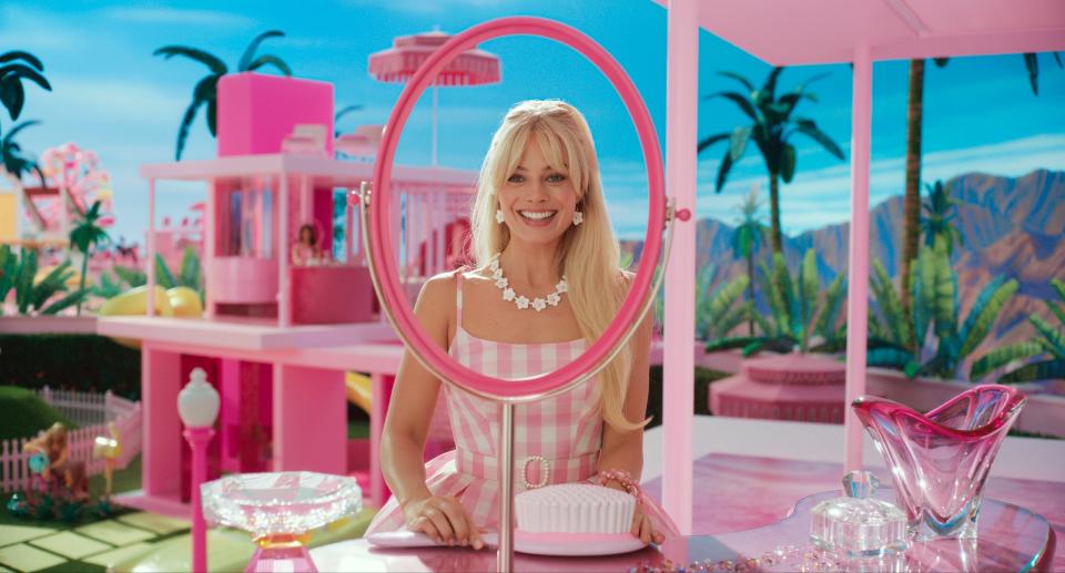 This image released by Warner Bros. Pictures shows Margot Robbie in a scene from "Barbie." With the Friday, July 21, 2023, release of the "Barbie movie" starring Robbie, the color “Barbie Pink” has been thrown into the spotlight on social media and the world of fashion.