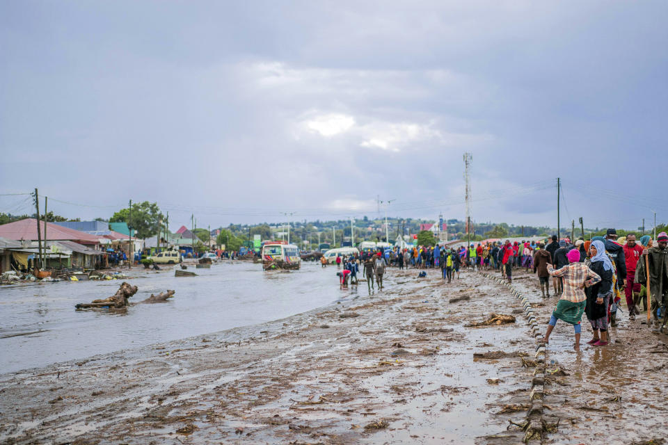 Resident are seen standing in the town of Katesh, in Tanzania, Sunday, Dec 3, 2023. At least 40 people have been killed and 80 others injured in landslides caused by flooding in northern Tanzania, a local official has said, with warnings the toll would rise.(AP Photo).