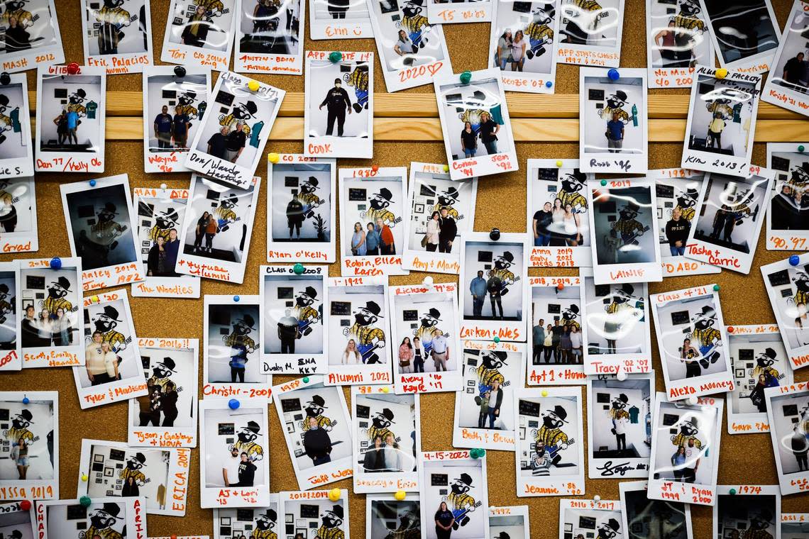 Pictures of Appalachian State alumni hang on the wall at Mountaineer Mania in Boone, N.C., Tuesday, Aug. 30, 2022.