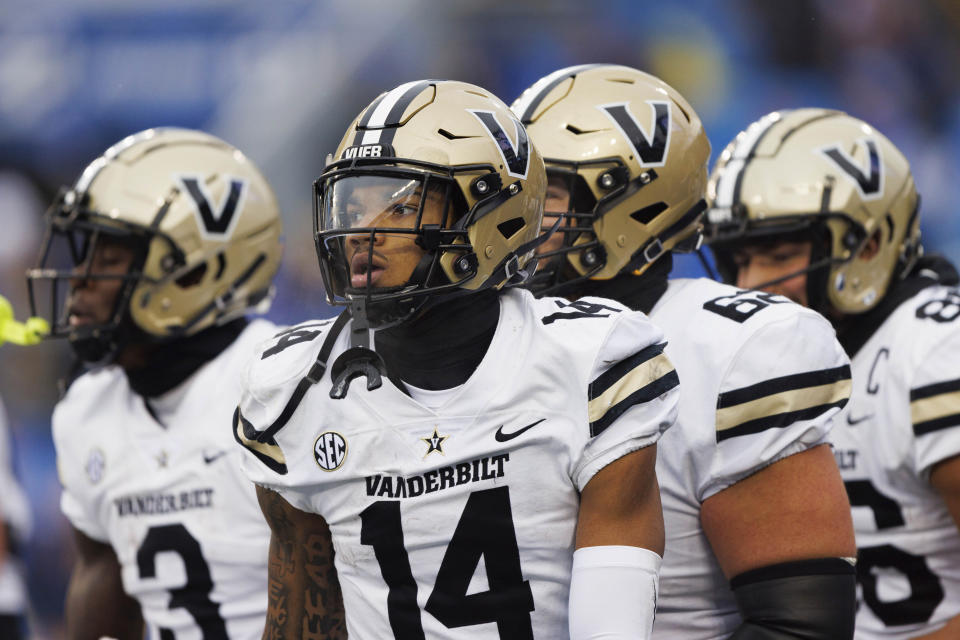 Vanderbilt wide receiver Will Sheppard (14) runs to the sideline after scoring the game winning touchdown against Kentucky during the second half of an NCAA college football game in Lexington, Ky., Saturday, Nov. 12, 2022. (AP Photo/Michael Clubb)