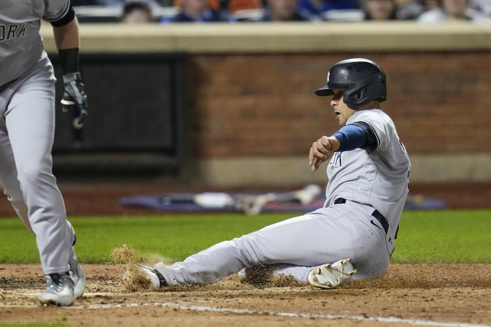 New York Yankees' Isiah Kiner-Falefa steals home plate during the seventh inning of a baseball game against the New York Mets Wednesday, June 14, 2023, in New York. (AP Photo/Frank Franklin II)