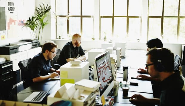 Businessmen and businesswoman working in office