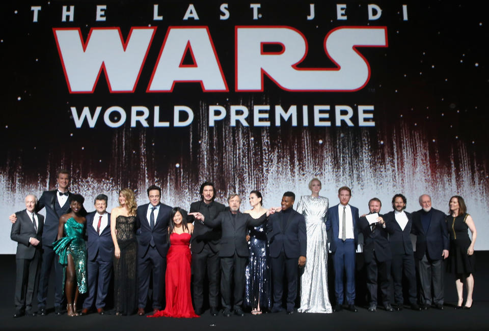 The cast assembles onstage ahead of the screening: from left, Anthony Daniels (C-3PO), Joonas Suotamo (Chewbacca), Lupita Nyong’o (Maz), Andy Serkis (Snoke), Laura Dern (Holdo), Benicio Del Toro (DJ), Kelly Marie Tran (Rose), Adam Driver (Kylo), Mark Hamill (Luke), Daisy Ridley (Rey), John Boyega (Finn), Gwendoline Christie (Phasma), Domhnall Gleeson (Hux), writer-director Rian Johnson, producer Ram Bergman, composer John Williams, and producer Kathleen Kennedy. (Photo: Jesse Grant/Getty Images for Disney)